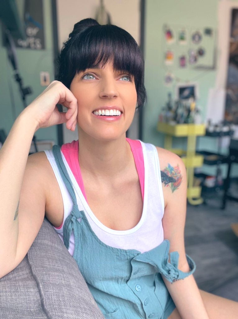 me sitting in my studio smiling