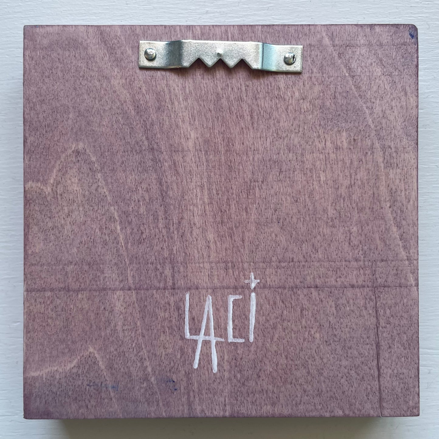 Back of the frame with sawtooth hanger on the top and my signature at the bottom