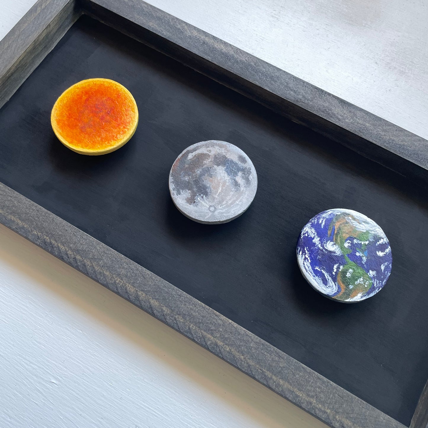 A top down, angular view of the three clay disks.