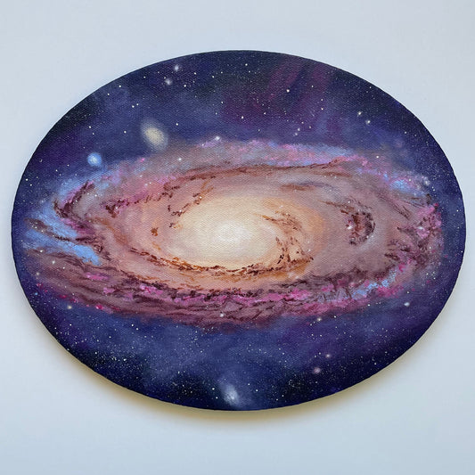 Colorful oval painting of the Andromeda Galaxy