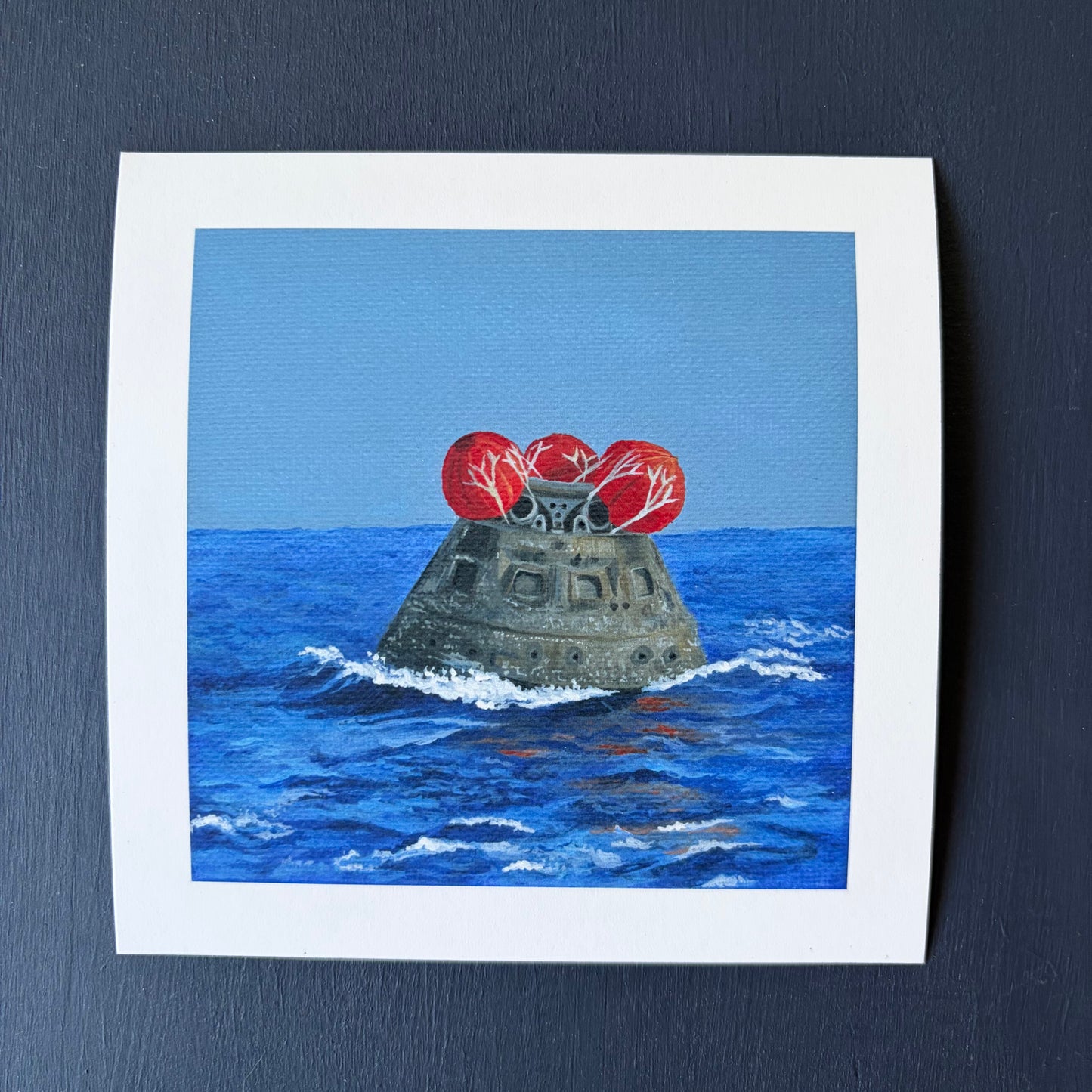 Mini print of Orion capsule floating in ocean with red balloons on top