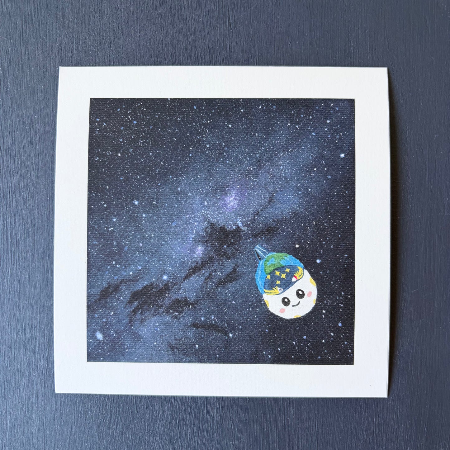 Mini print of the Milky Way. A dense blue and purple star field. Rise is painted in the bottom right corner.