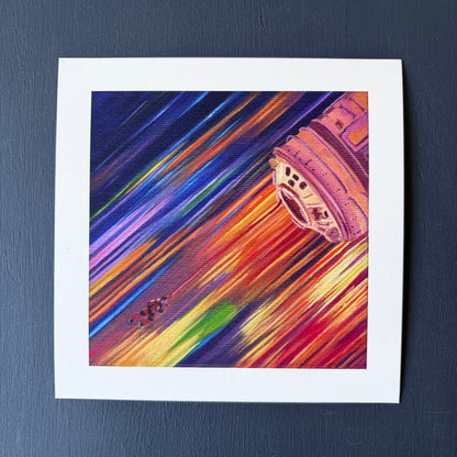 mini print of a tiny astronaut and spaceship with a background of colorful streaks