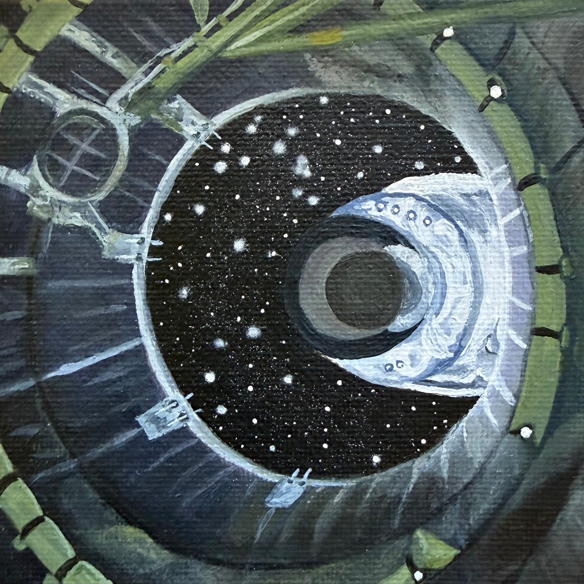 Close up of mini painting of spacecraft separation shown from the inside
