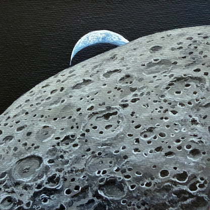 Mini painting of the lunar surface in the foreground and a crescent Earth setting behind the Moon