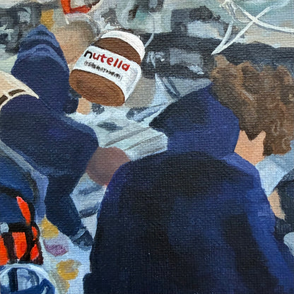 Close up of mini painting with Nutella jar in foreground and Artemis astronauts in the background