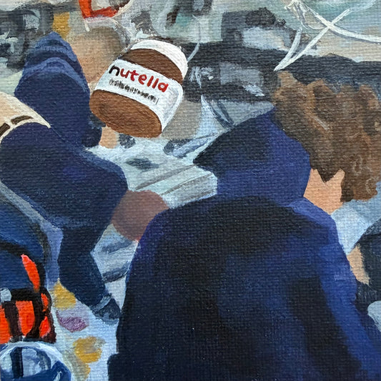Close up of mini painting with Nutella jar in foreground and Artemis astronauts in the background