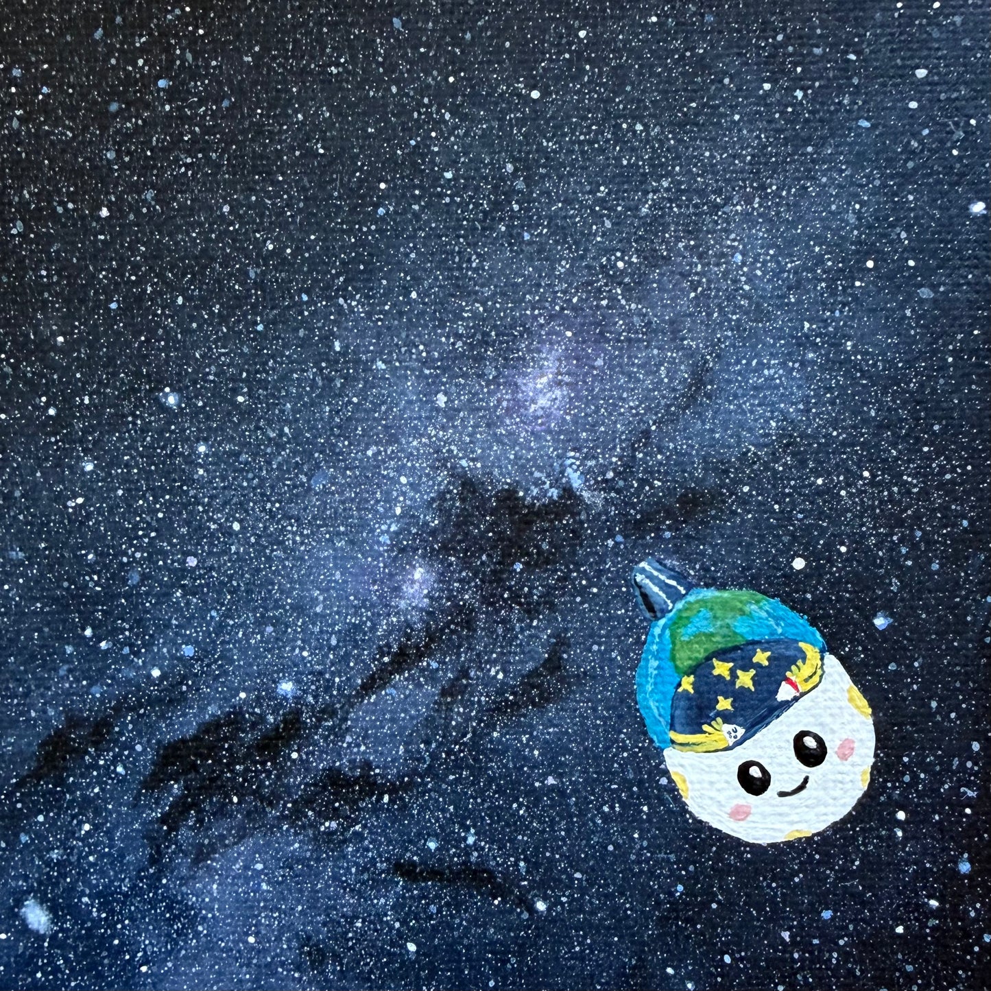 Close up of mini painting of the Milky Way. A dense blue and purple star field. Rise is painted in the bottom right corner.