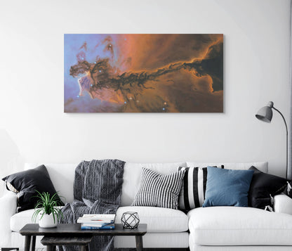Living room with a white sofa, decorative pillows, and a large nebula painting on the wall.