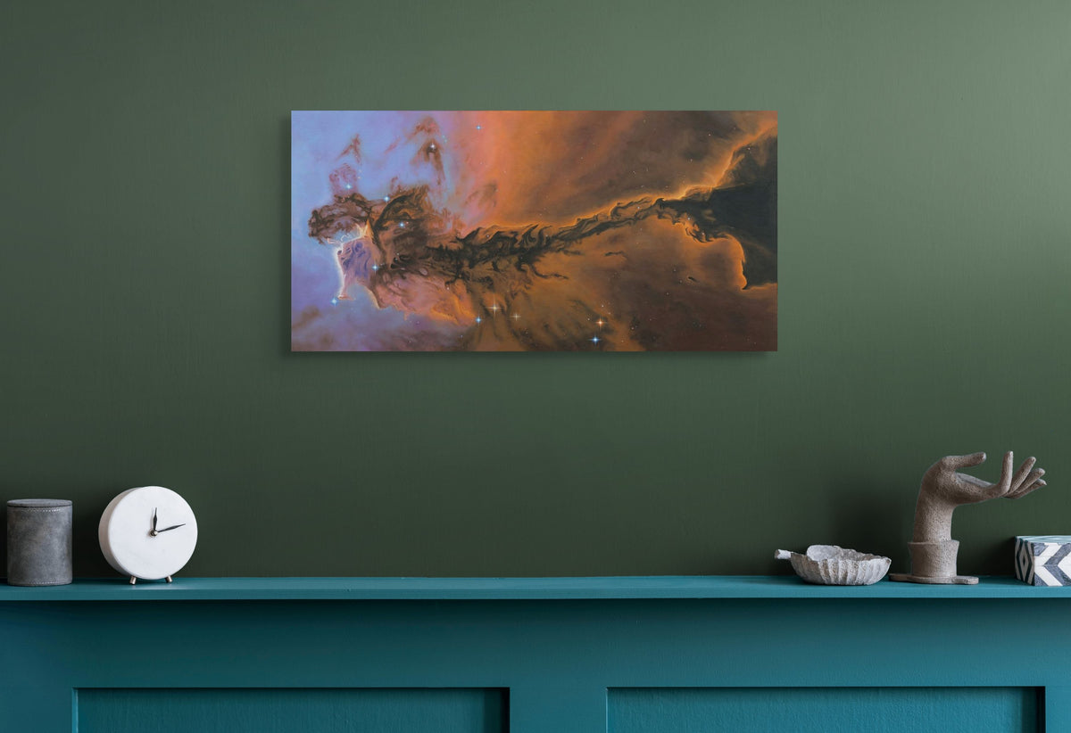 Nebula painting on a green wall above a teal console table with decorative items.