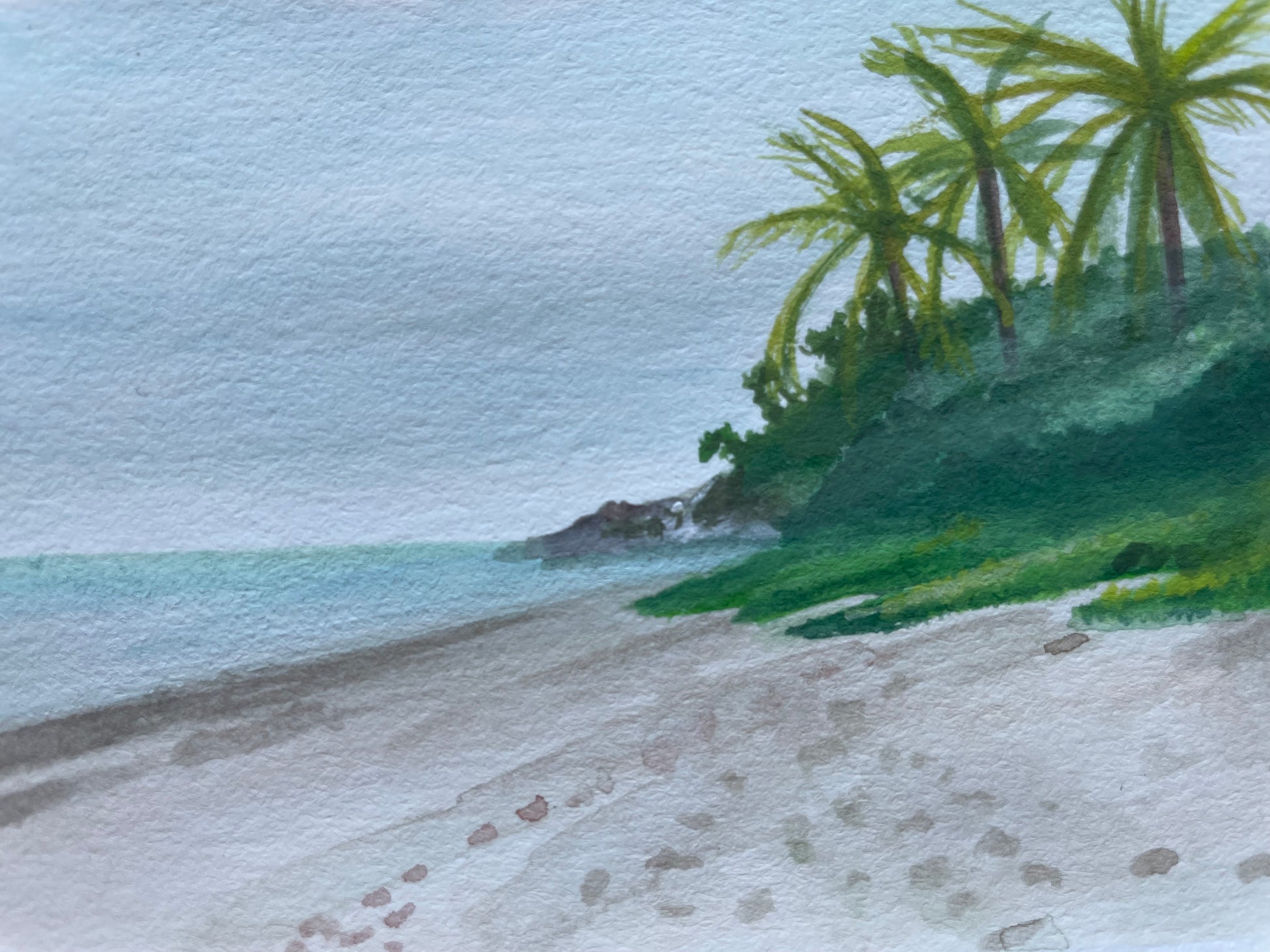 Watercolor painting of the ocean, beach, and distant palm trees