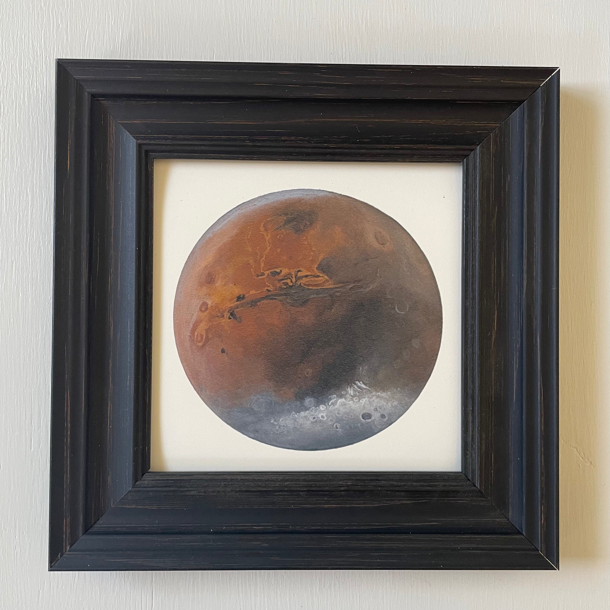 Mars print in black frame with white background