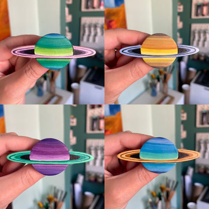 Four panel picture of each mini Saturn in my left hand close to the camera