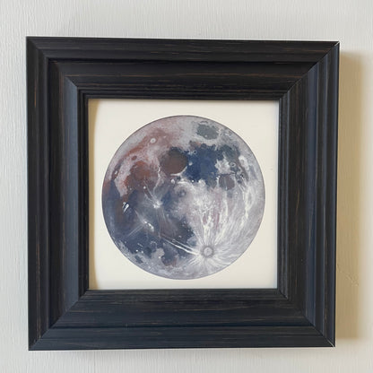 Print of the Moon in black frame with white background