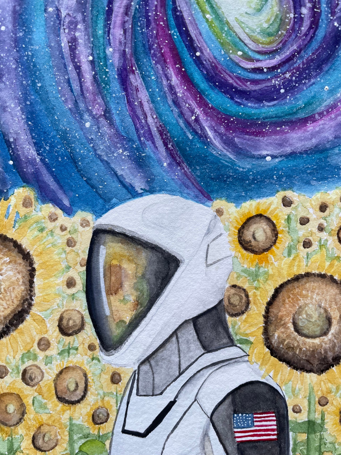 Astronaut in a field of sunflowers with a purple and blue galaxy sky